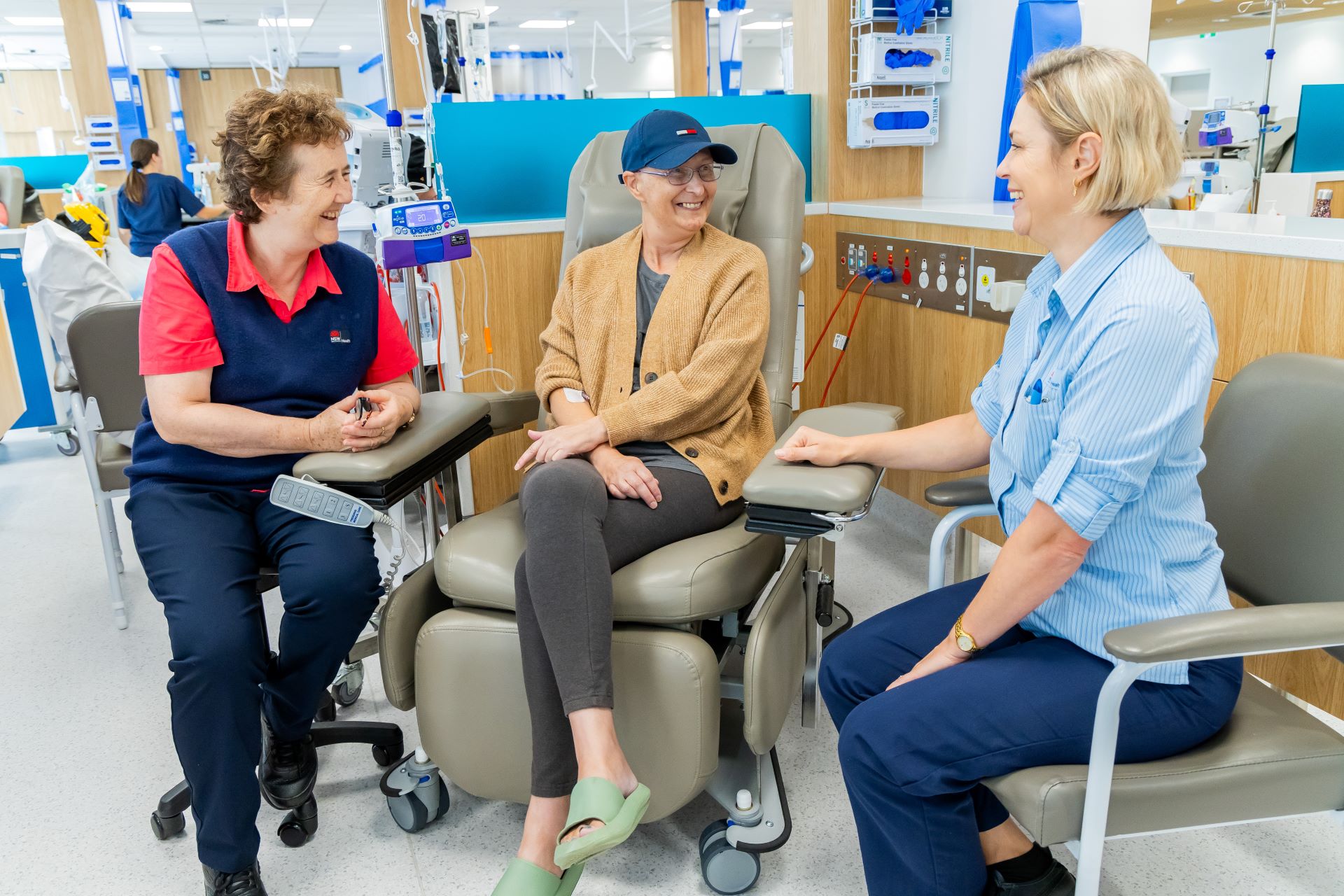 Clinicians talking to a patient