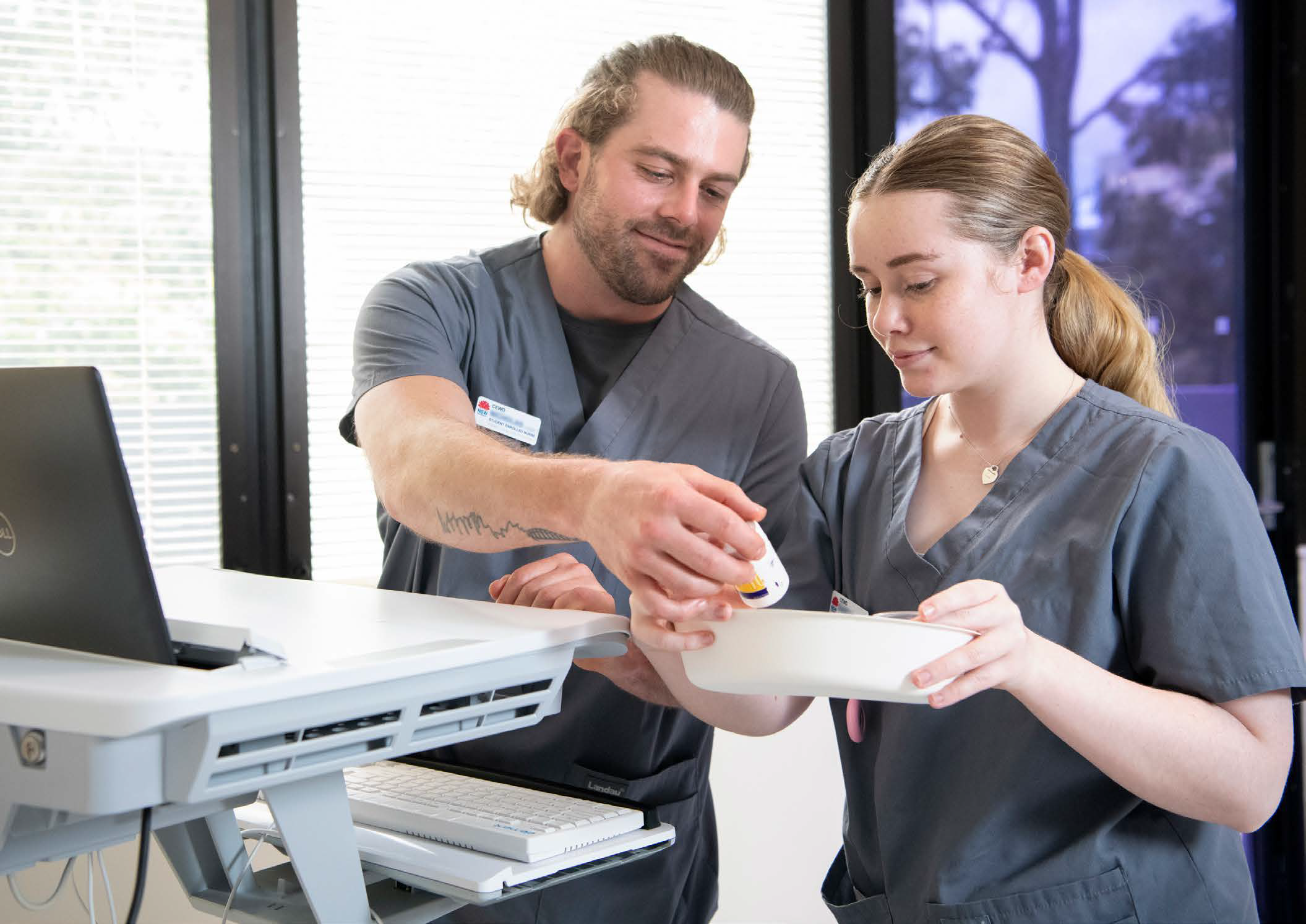 Two people looking at a specimen