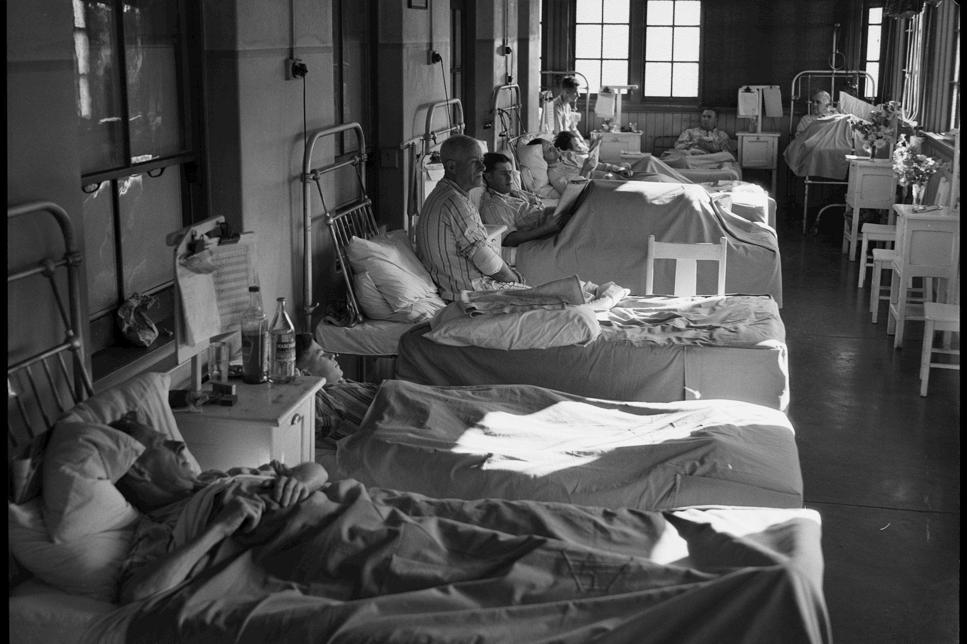 Rows of patients in hospital beds 1941