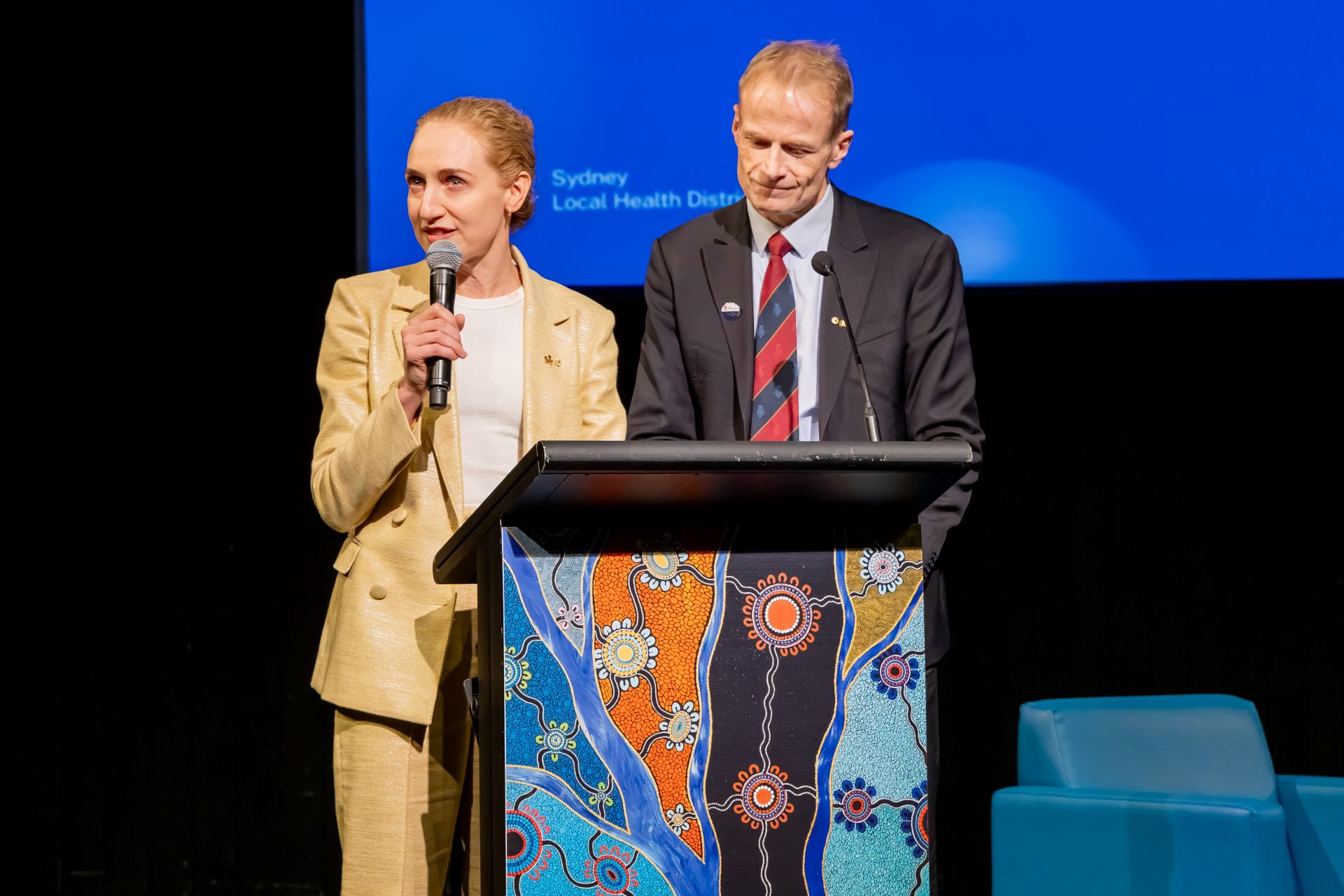 Two people giving a lecture.