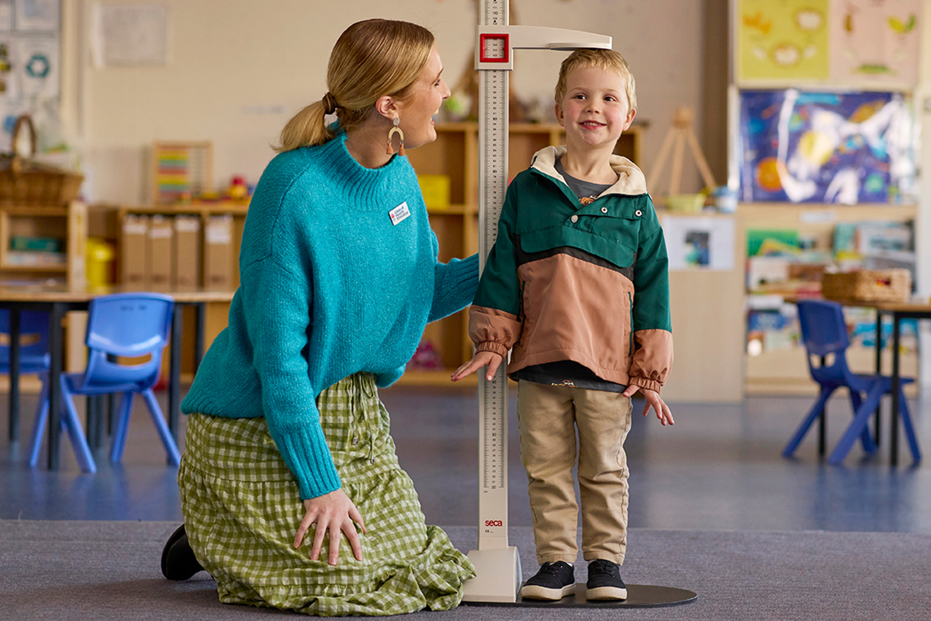 Brighter Beginnings nurse measuring a child's height