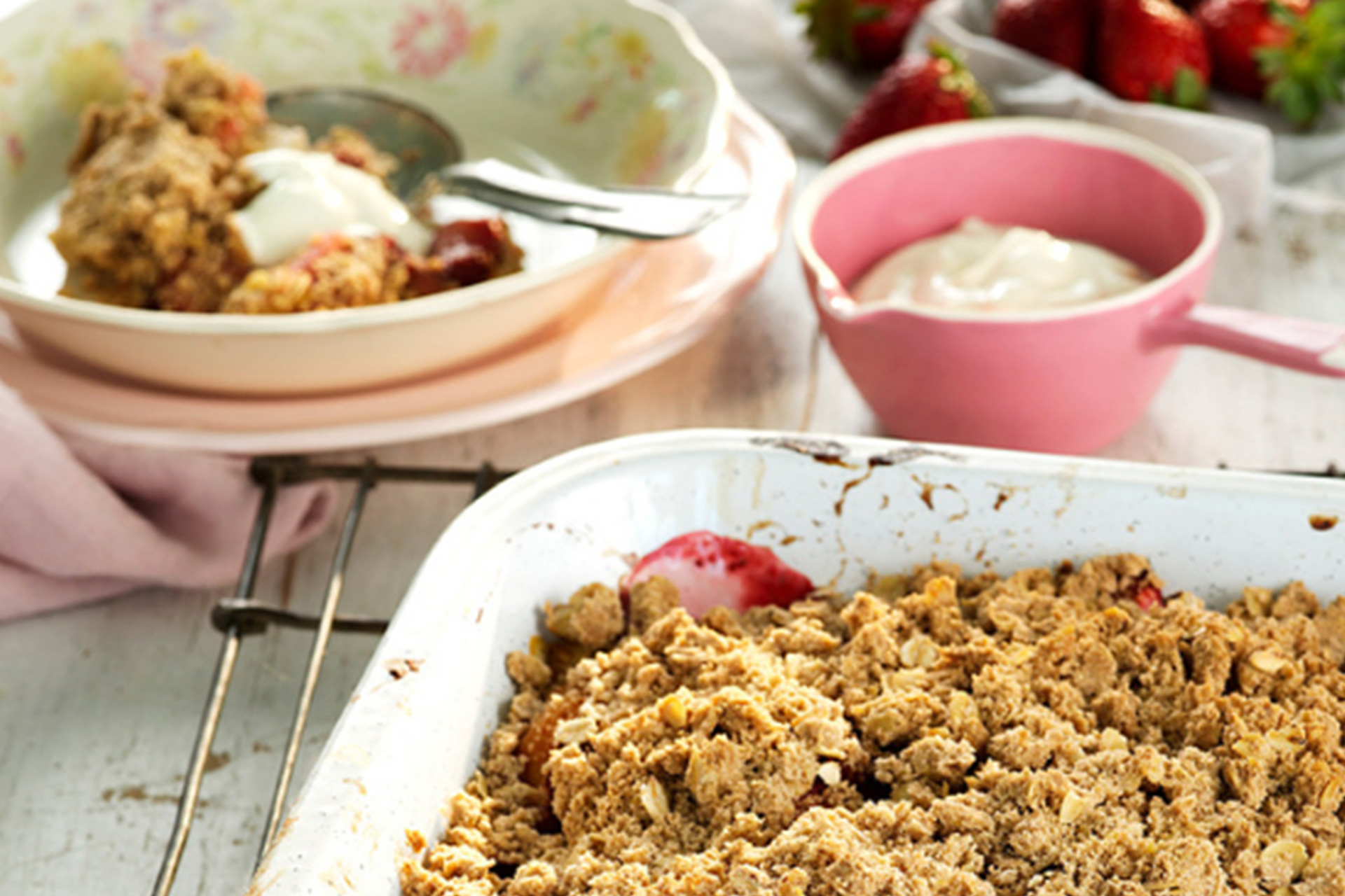 Sunset crumble in baking dish next to plated dish