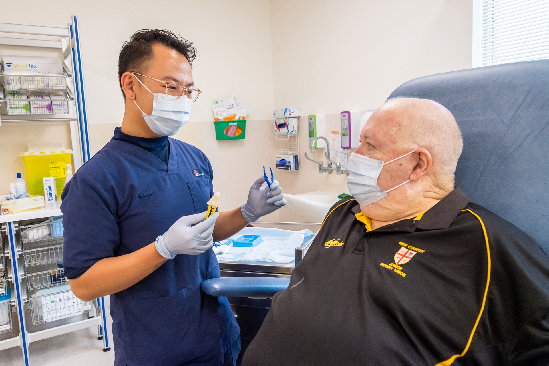 Sydney District Nursing staff member examining and patient in clinical setting