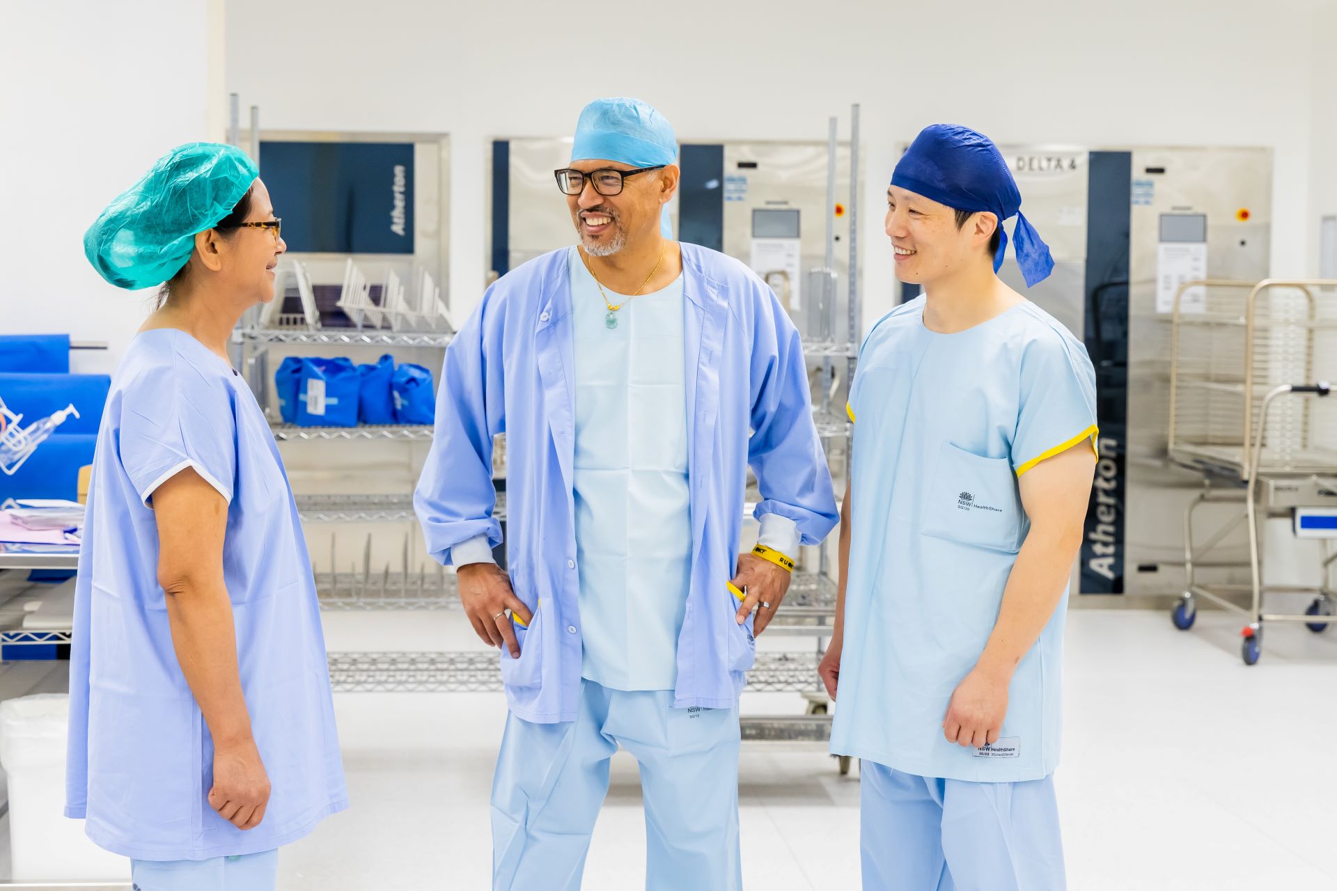 Three staff members in a laboratory setting