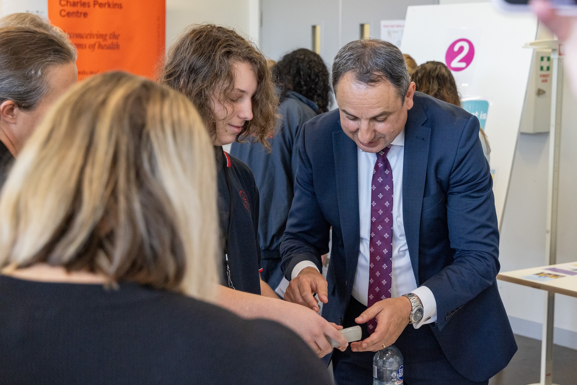 NSW Department of Education Secretary interacting with student during his visit