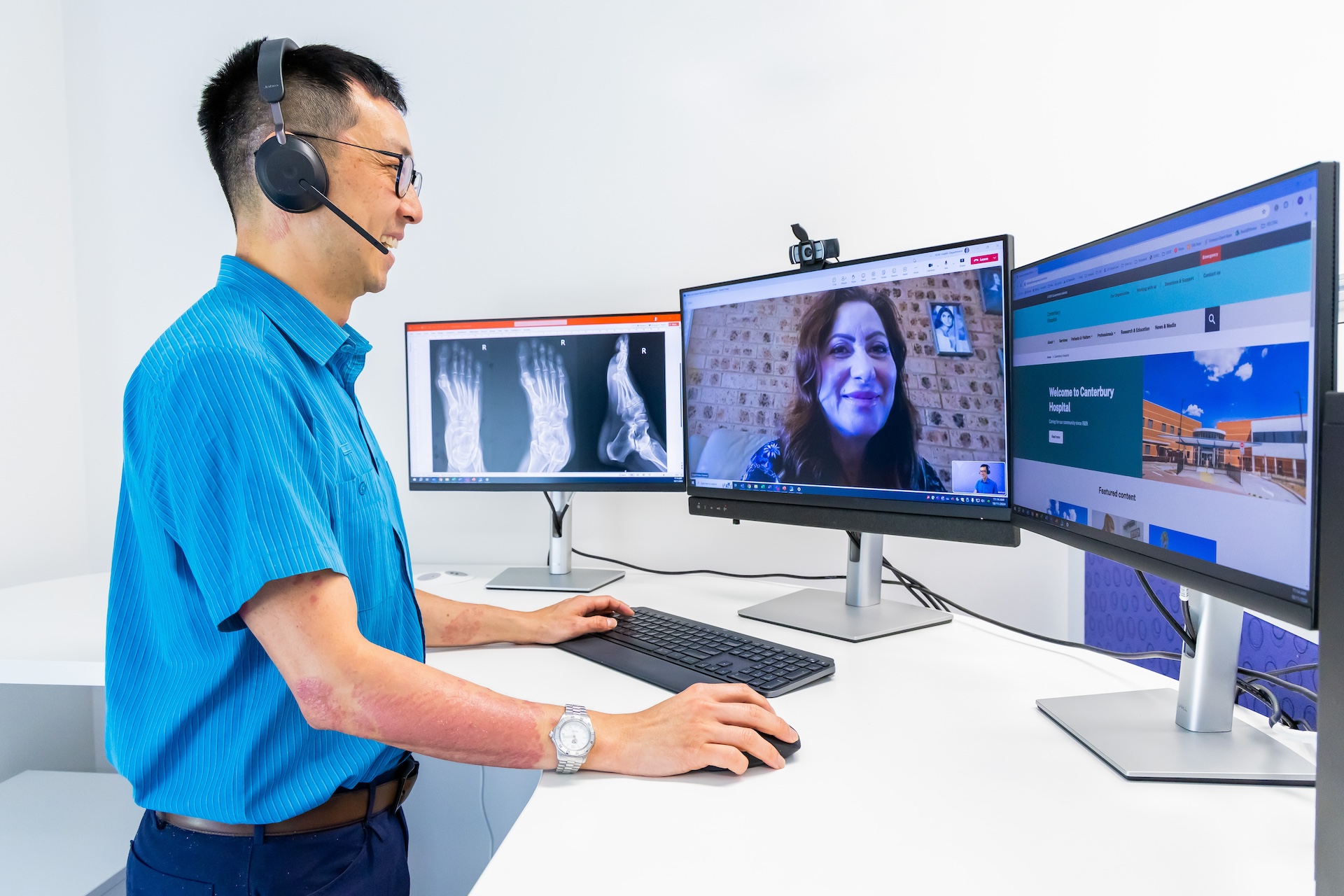 Photo of a physiotherapist speaking to patient through video conference