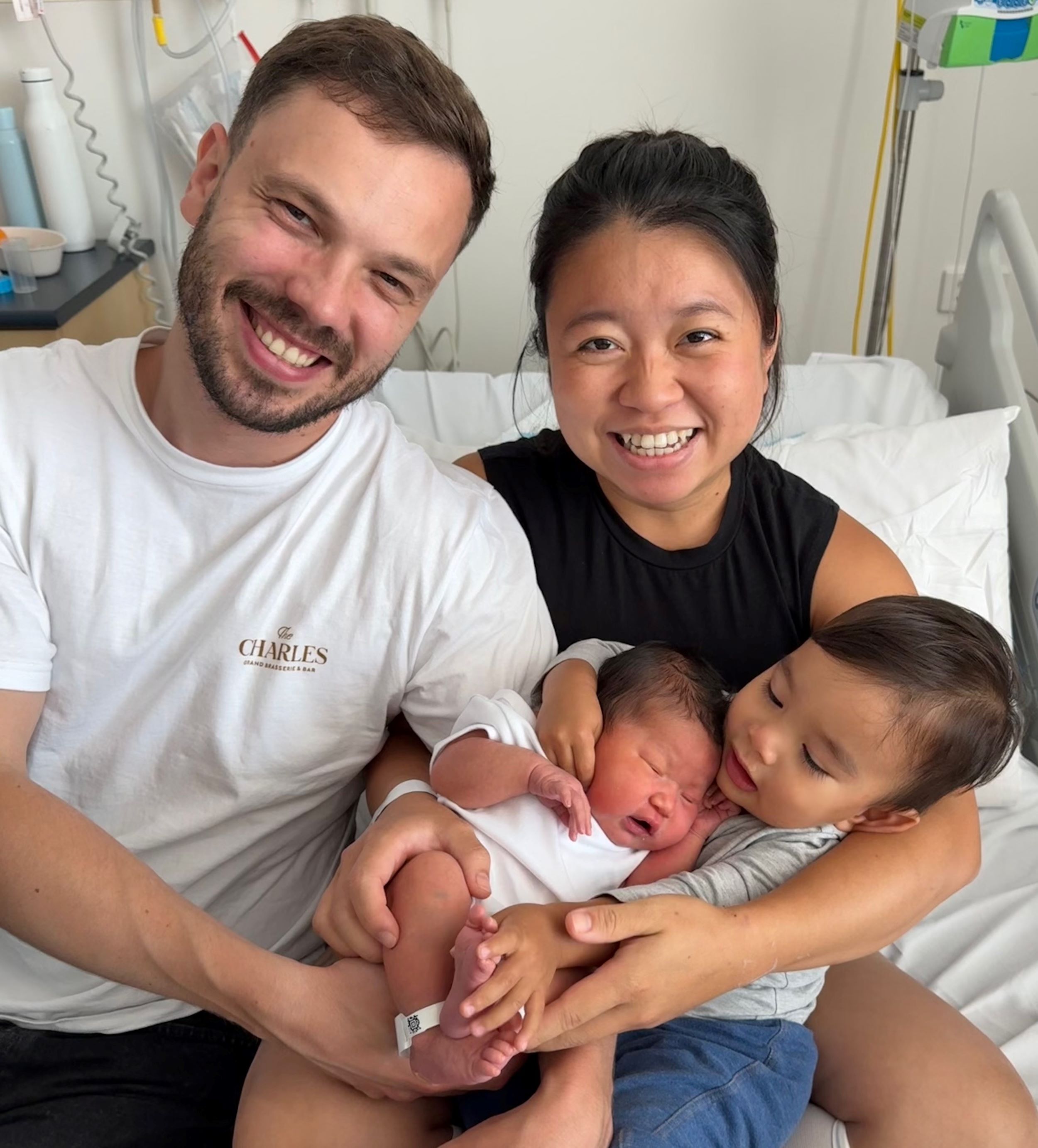 Family holding new born baby