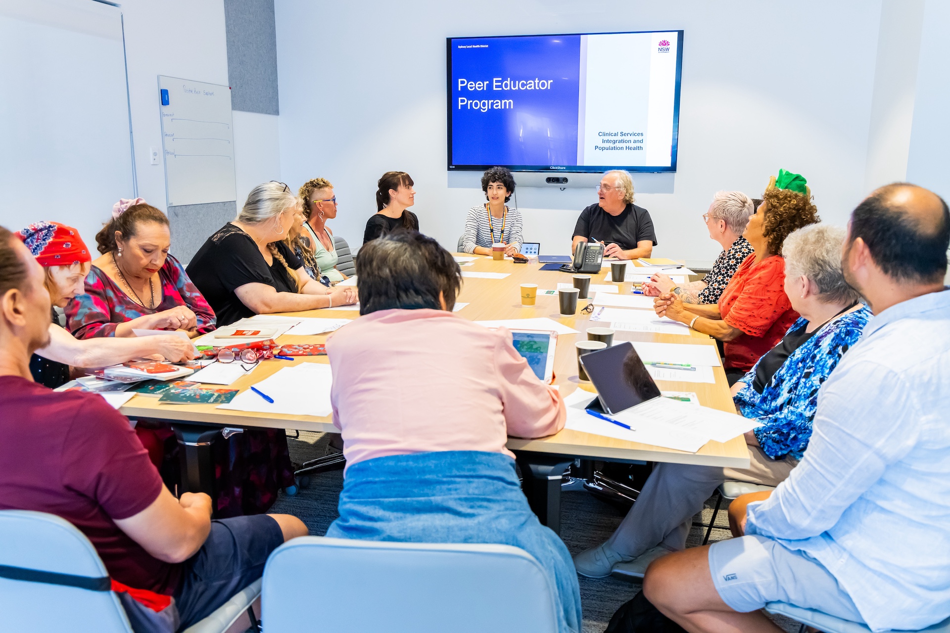 group os peer educators seated around an office table