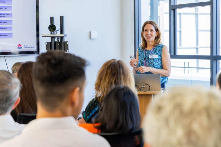 Professor Kate Wyburn at lectern
