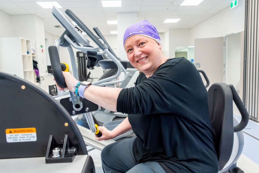 Woman in a gym using exercise equipment