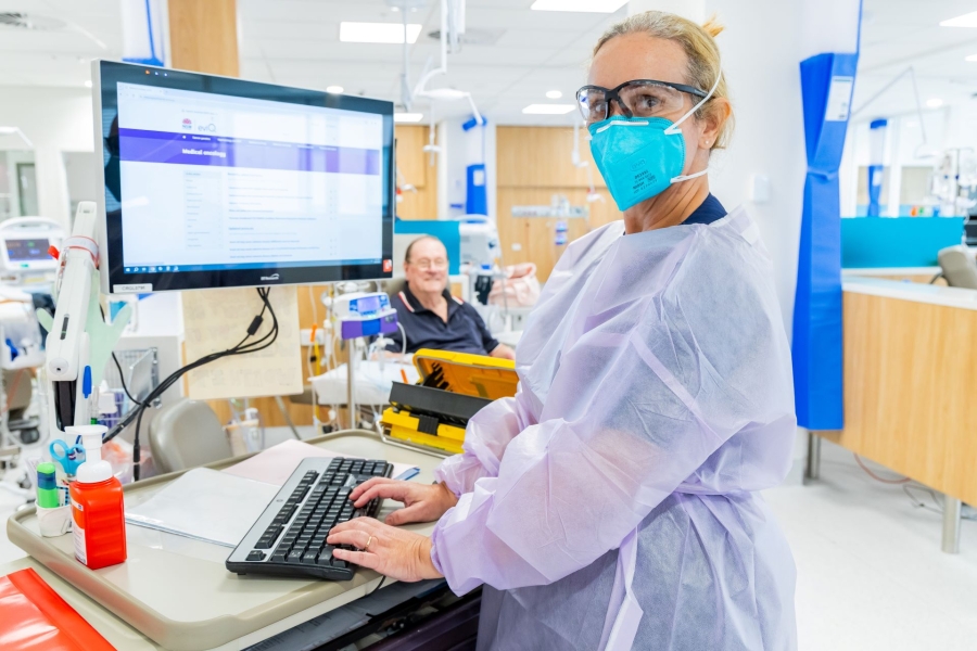 A clinician at a workstation