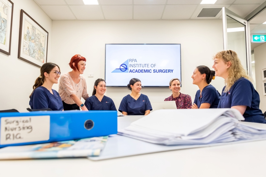 Group of nurses sitting around a table in a meeting