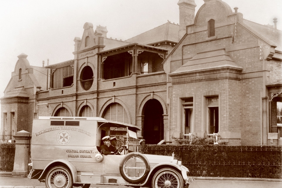 Black and white photo of Balmain Hospital with ambulance outside
