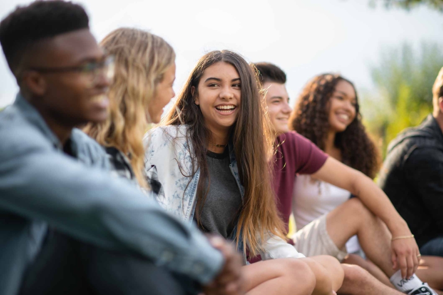 Group of young people sitting and talking