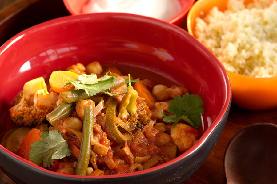 Simple veg stew with a Moroccan twist served in red bowl