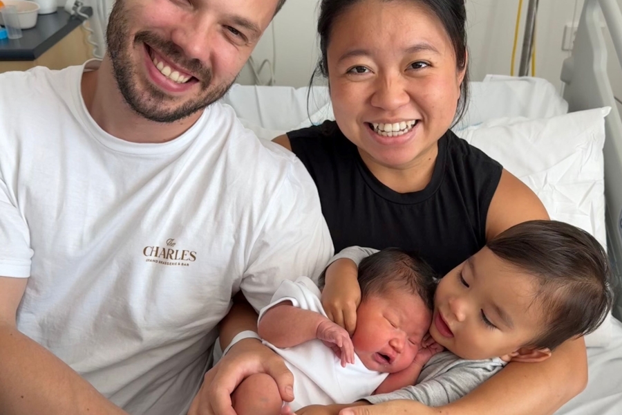 Family holding new born baby