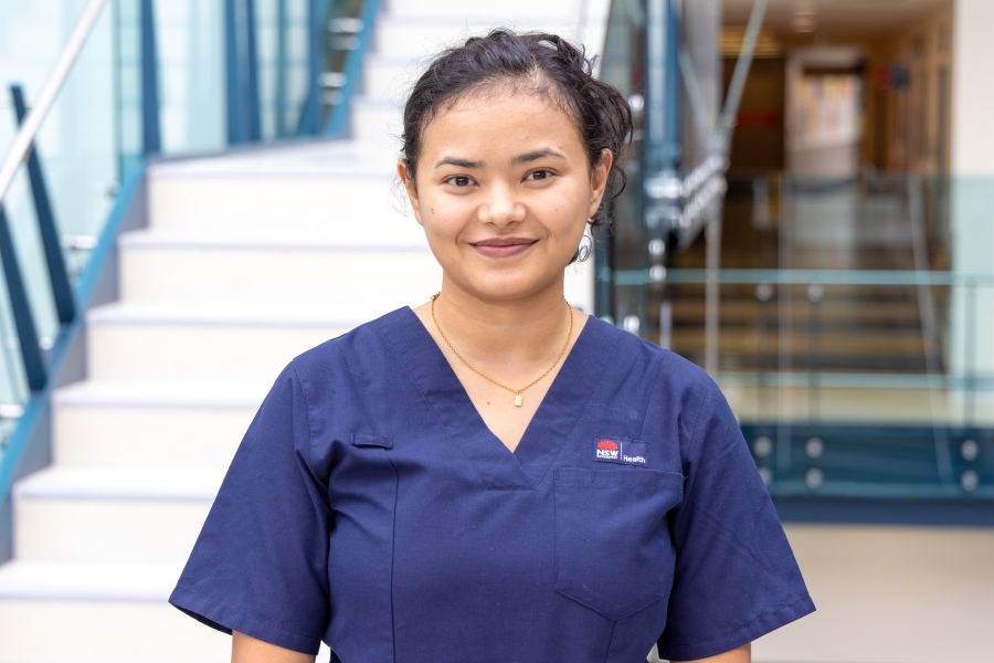 Portrait of a nurse with hospital in the background